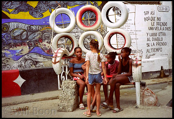 Young children
resting on a bench in hamel street, Havana