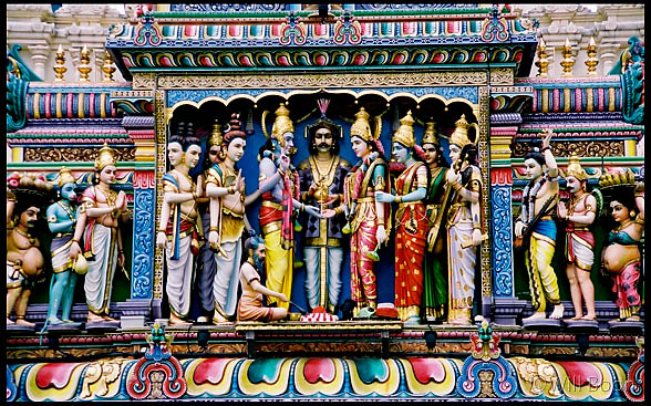 Beautiful figurative sculptures
 seen above a Hindu temple, Waterloo Road, Singapore