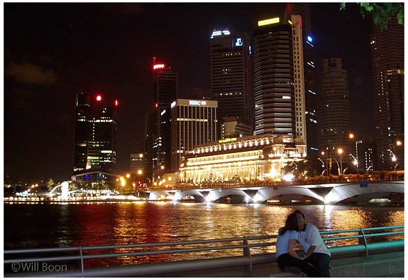 Bright
 lights of the civic district illuminate the night sky, Boat Quay, Singapore