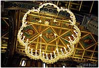 Beautiful chandelier illuminates the ceiling of Matthias Church, Castle Hill, Budapest