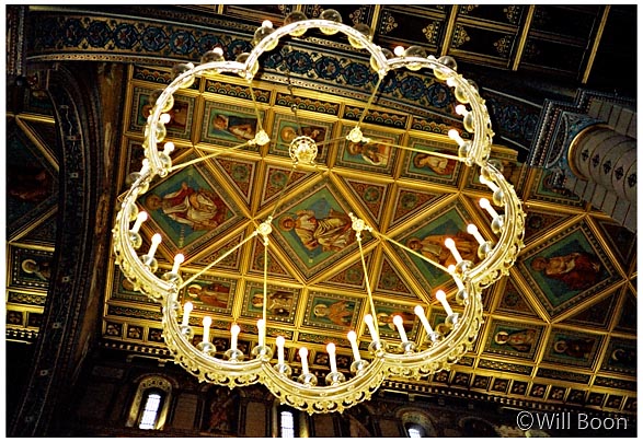 Beautiful chandelier illuminates the ceiling of Matthias Church, Castle Hill, Budapest