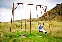 Blandine plays on the swings, Okains bay, Bank Peninsula