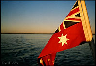 Australian flag at Sunset, Fraser Island, Queensland