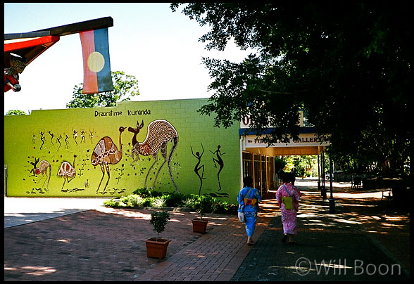 Two Japanese girls stroll through downtown Kuranda, Queensland