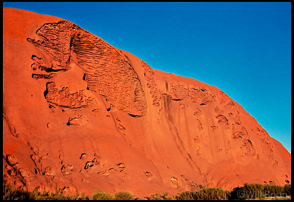 Human head shape visible on the rock face of Uluru