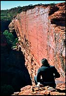 Woman sitting on the canyon edge, Kings Canyon, Red Center, Australia